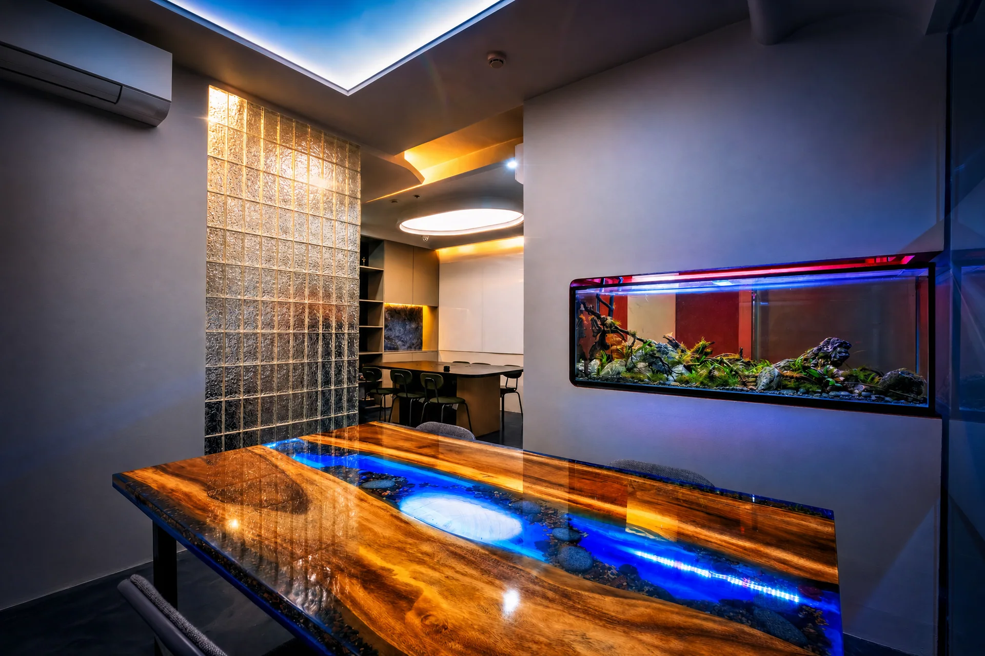 Sundial’s hand-cast resin river table, aquarium, and glass-block partition